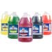 Four jugs of Carnival King cotton candy snow cone syrup in different colors.