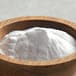 A bowl of Carnival King popcorn salt on a table.