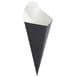 A black cone shaped container with white paper inside.