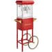 A red Carnival King popcorn popper machine with a cart.