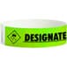 A green Carnival King wristband with "DESIGNATED DRIVER" in white text.