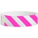 A white and pink striped Tyvek wristband.