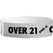 A white paper wristband with black text reading "OVER 21"