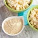 A bowl of popcorn with Carnival King Mustard Popcorn Seasoning powder.