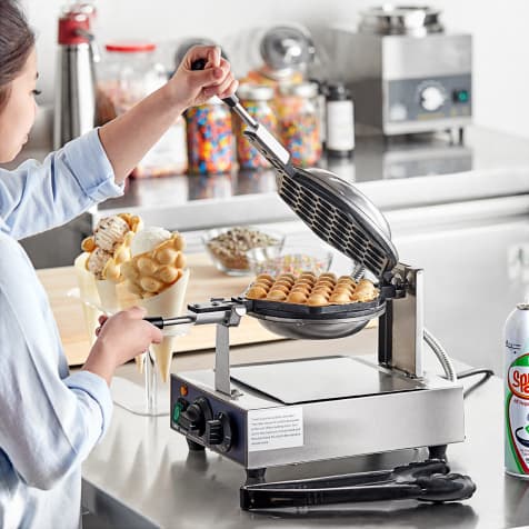 waffle maker in use at icecream parlor